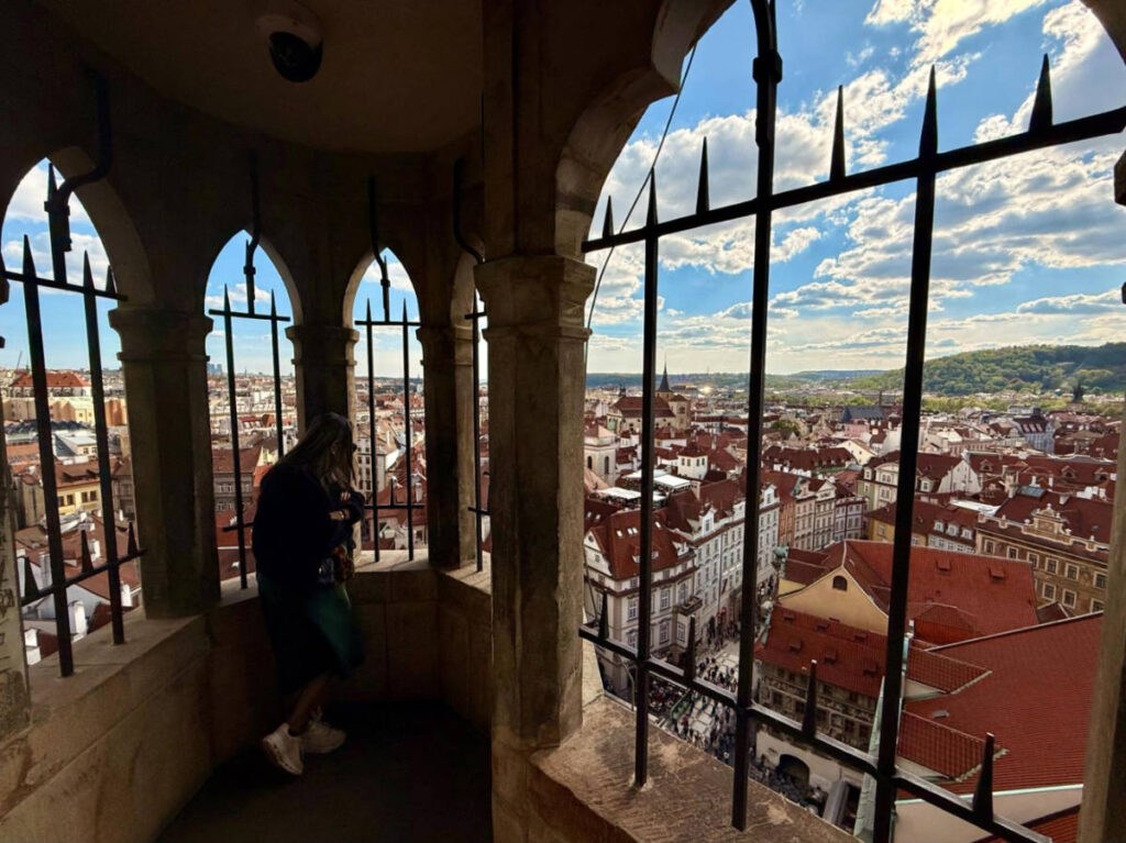 A woman enjoying the overlooking view from the viewpoint of Old Town Tower