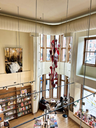 View of the displayed books and the reading nook from the top floor in Village Books and Paper Dreams