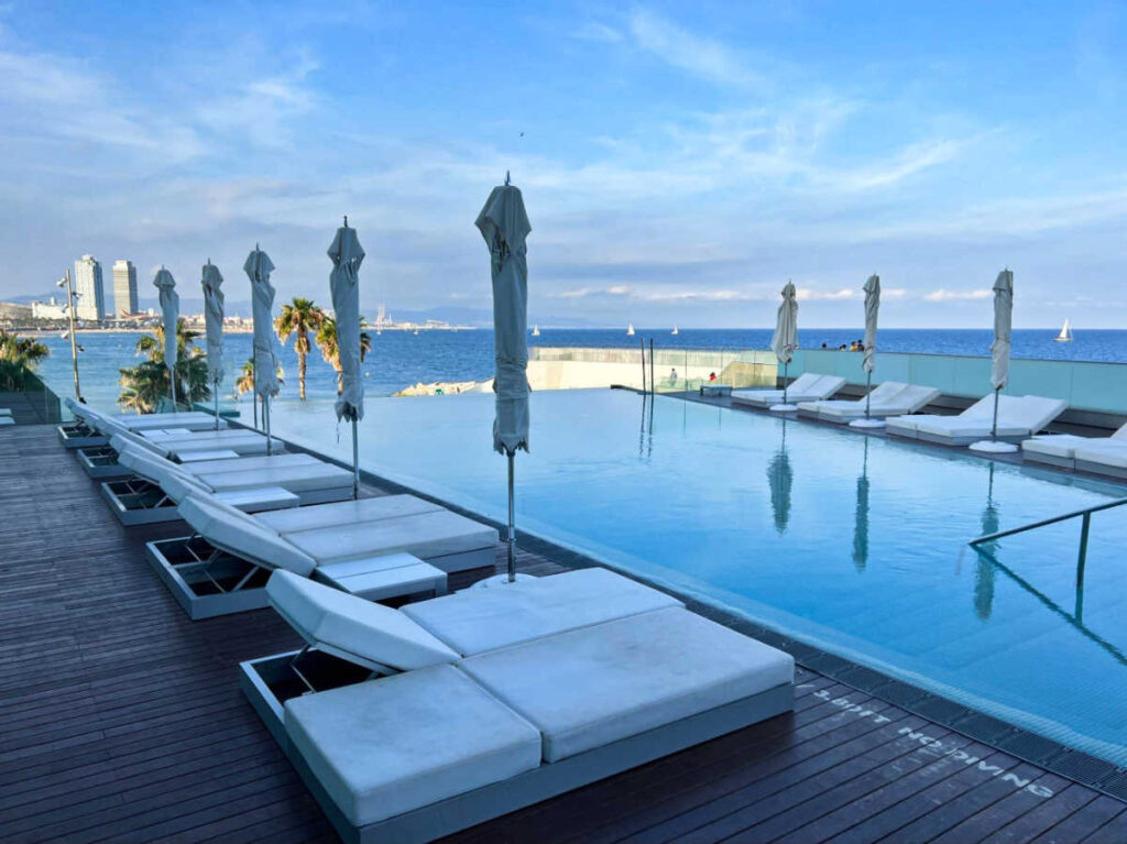 View of the pool area of W Barcelona overlooking the beach
