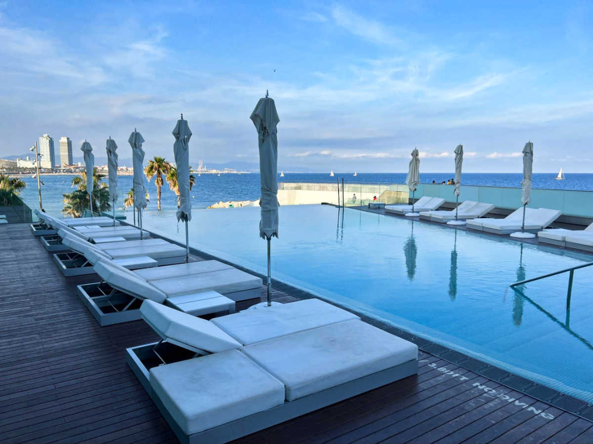 View of the pool area of W Barcelona overlooking the beach