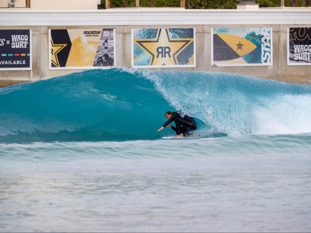 A man surfing in a wave pool in Waco Surf