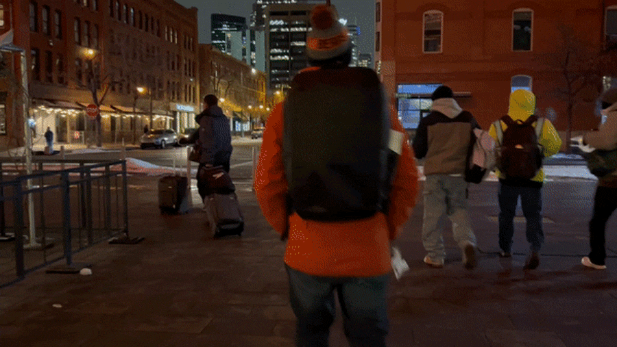 View of people walking at night in Denver