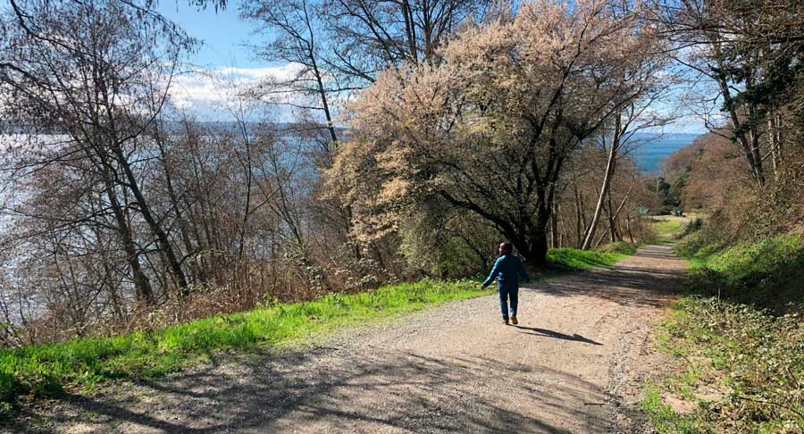 The author walking in Maury Island Marine Park in Vashon Island