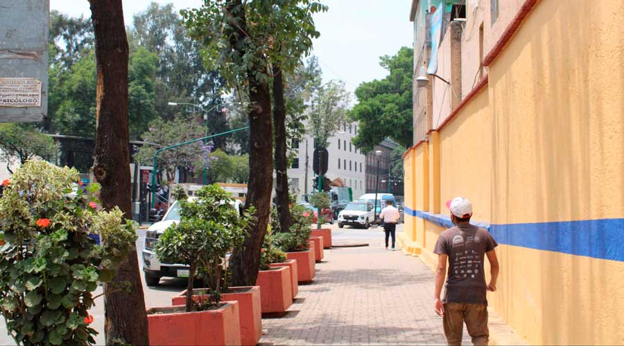 A man walking on a street side in Mexico City