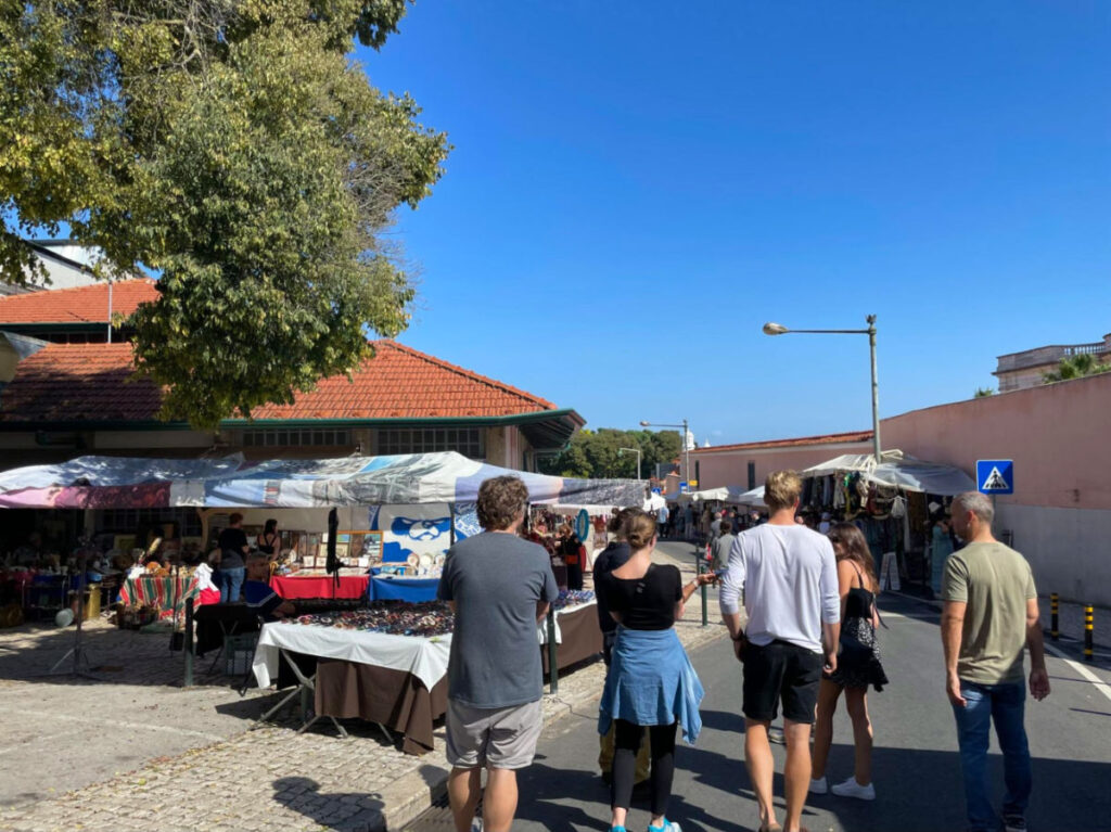 A group of people walking together on a tour through Lisbon