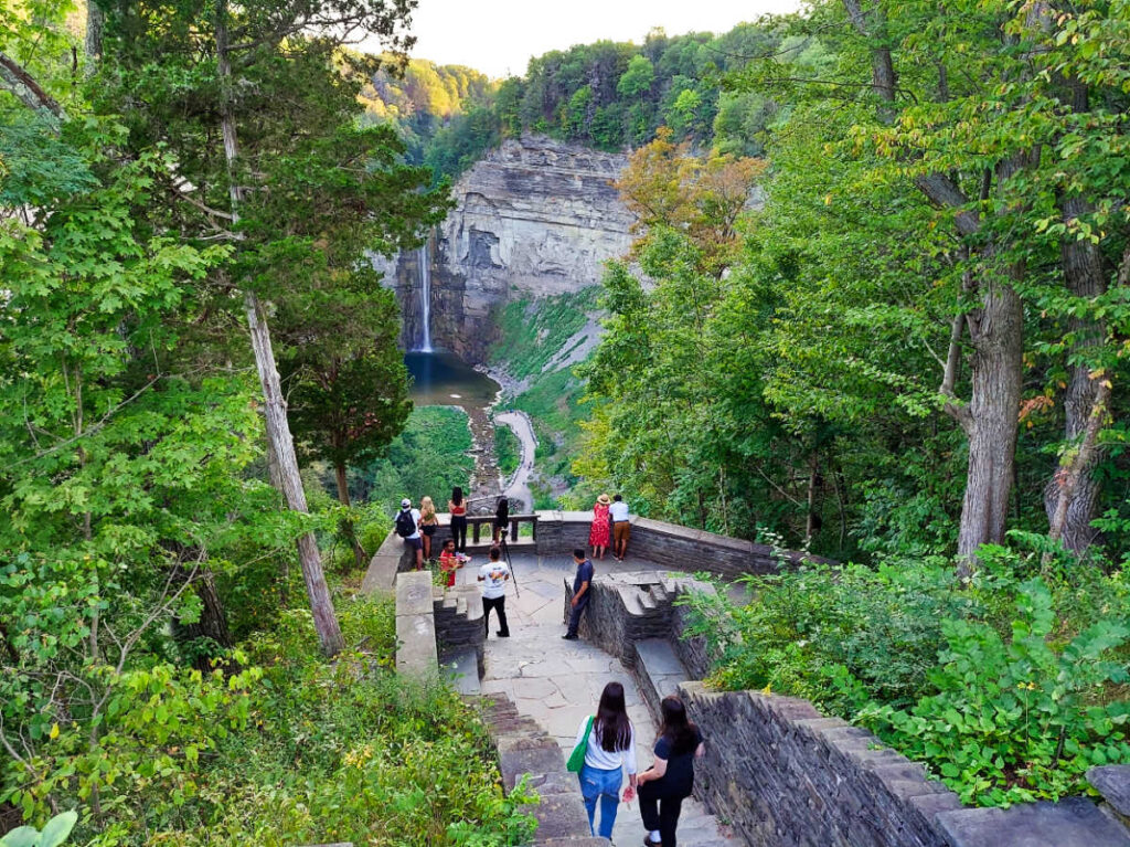 The tourists walking along the walkway leading to the Taughannock Falls viewpoint