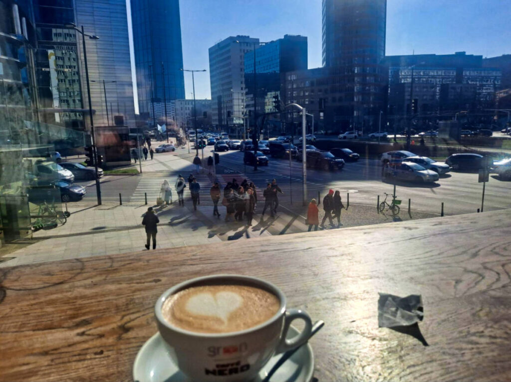 Overlooking view of the street from the glass window of the coffee shop in Warsaw