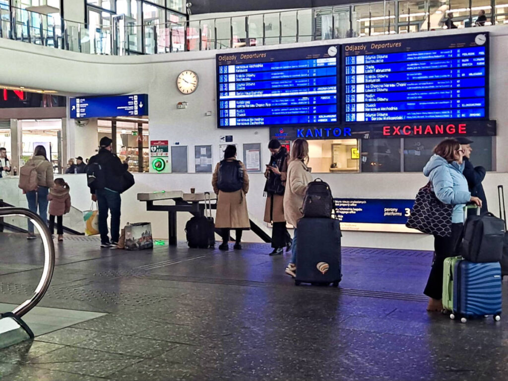 The travelers inside the central train station in Warsaw