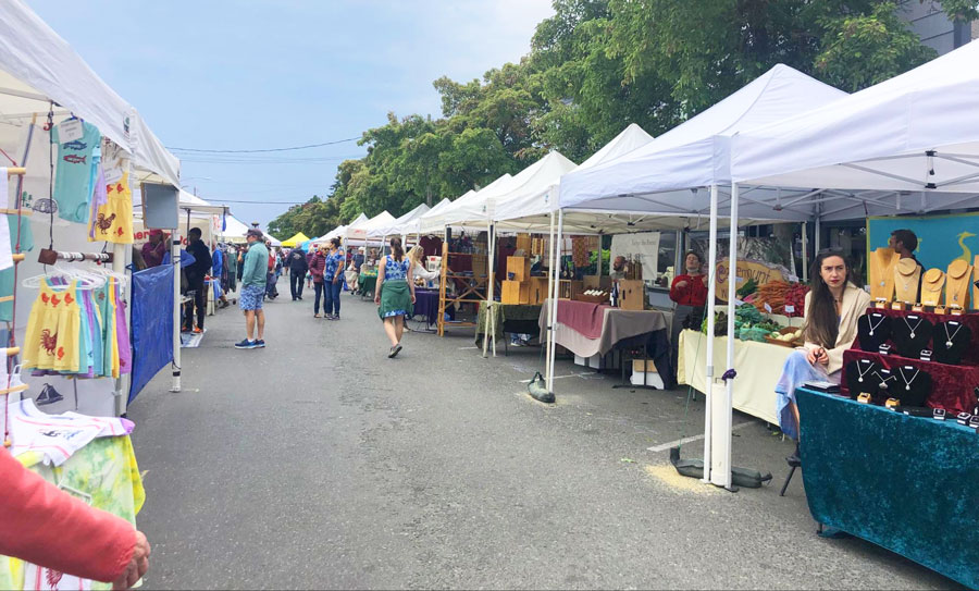 View of people and different market stall in Farmers Market in Washington State
