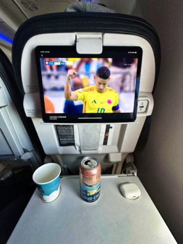An iPad playing the soccer game inside the plane