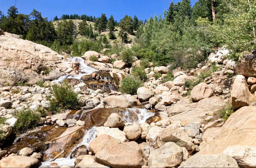View of the waterfall cascading down through the huge rocks