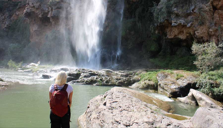 The author admiring a waterfall in Spain