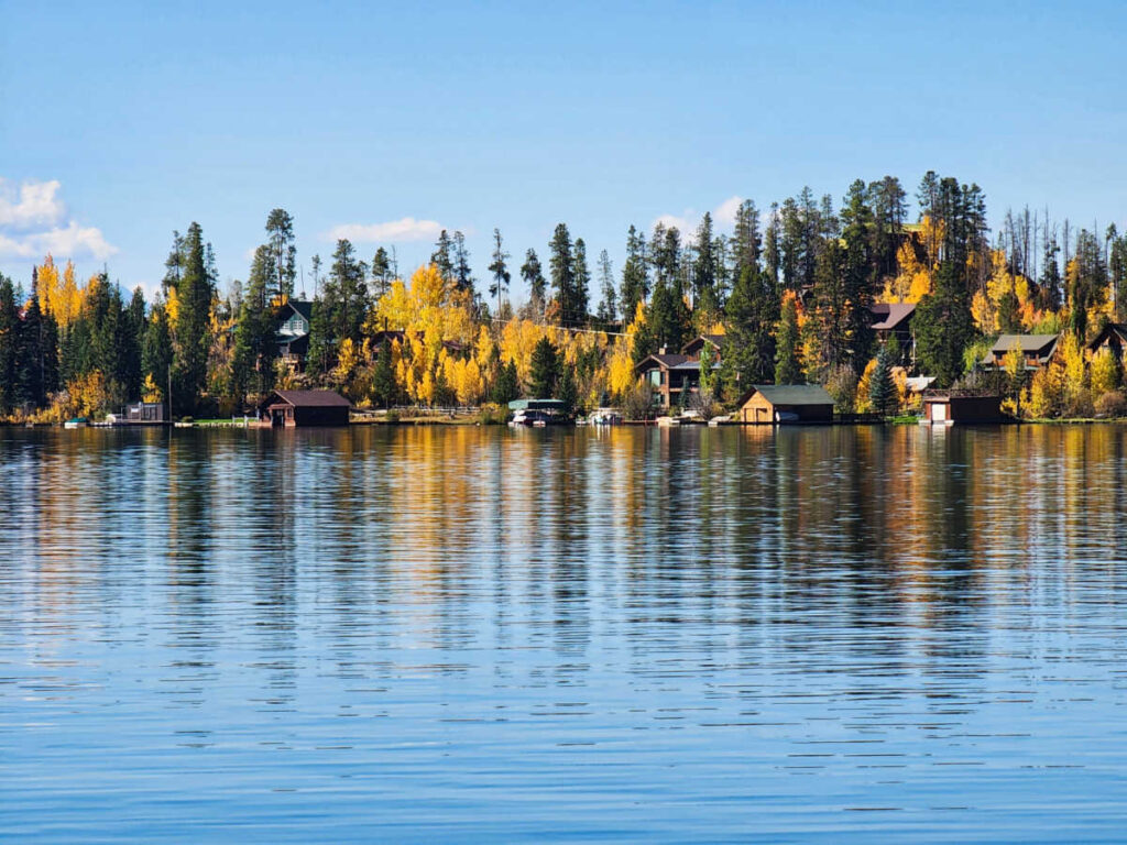 Scenic view of the fall foliage around the waterfront cabins