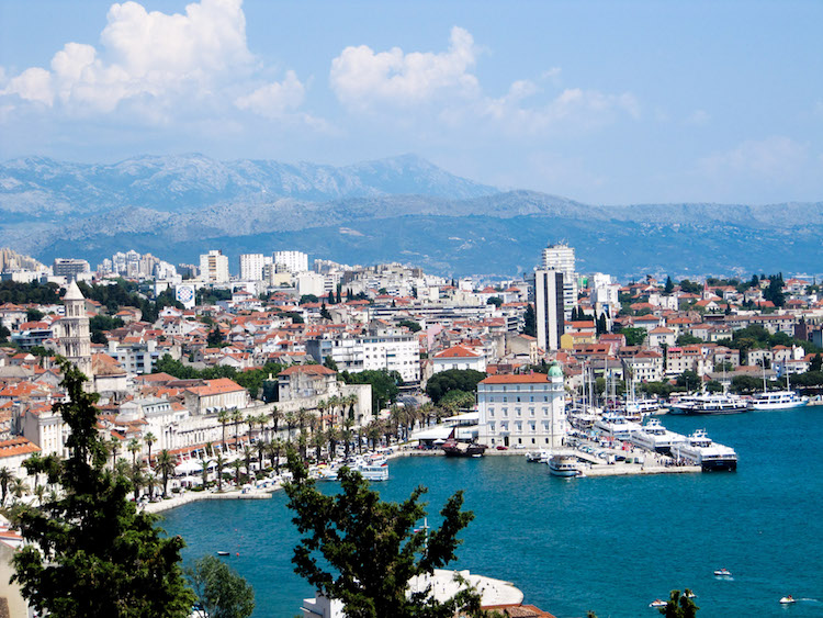 Aerial view of downtown split, the mountains, and the adriatic sea.
