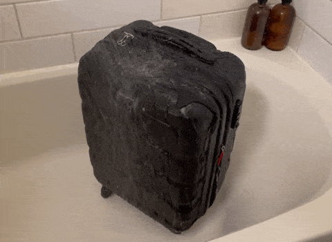 The Samsonite Omni showered on the bathtub
