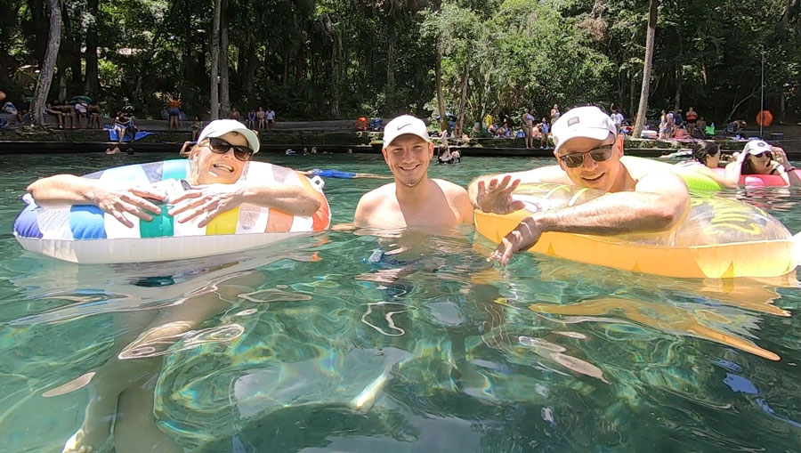 View of a family swimming on a natural spring