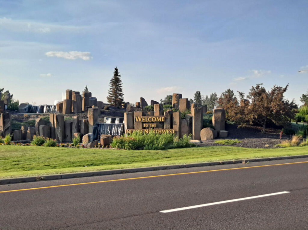 View of The Welcome to Inland Northwest Sign that is made from local, natural rock formations