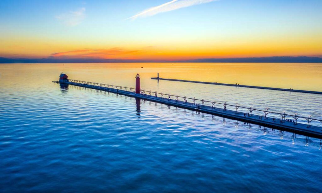 Scenic view of the Grand Haven Pier Lights and the colorful sky in West Michigan