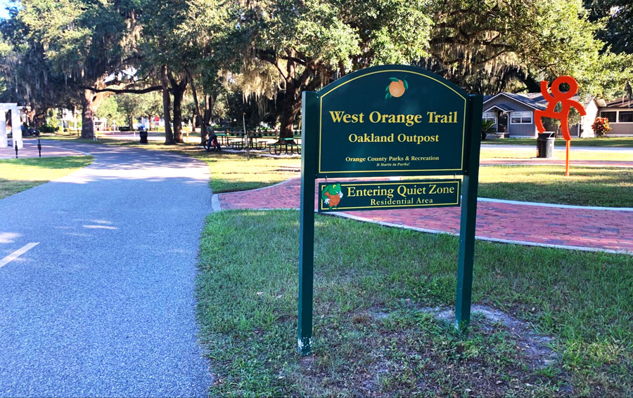 View of the West Orange Trail and its signage on the entrance