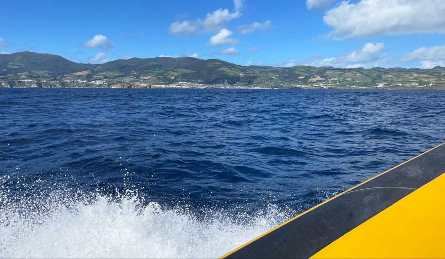 View of the blue water in Ponta Delgada while riding a boat for a whale watching tour