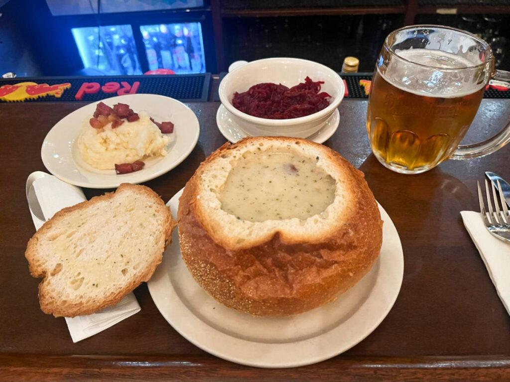 A bread bowl with white borscht and a pint of Polish Zywiec in Karczma