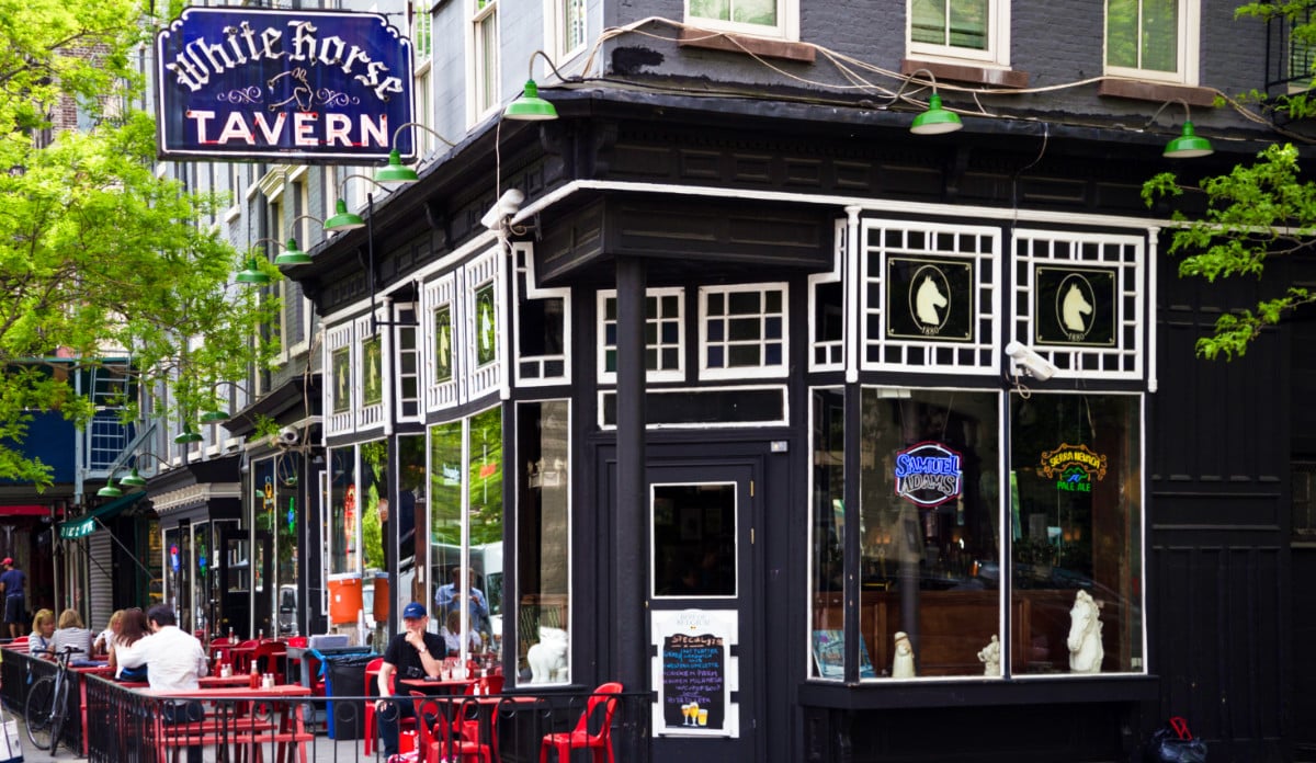 Exterior view of the White Horse Tavern and the people dining outside