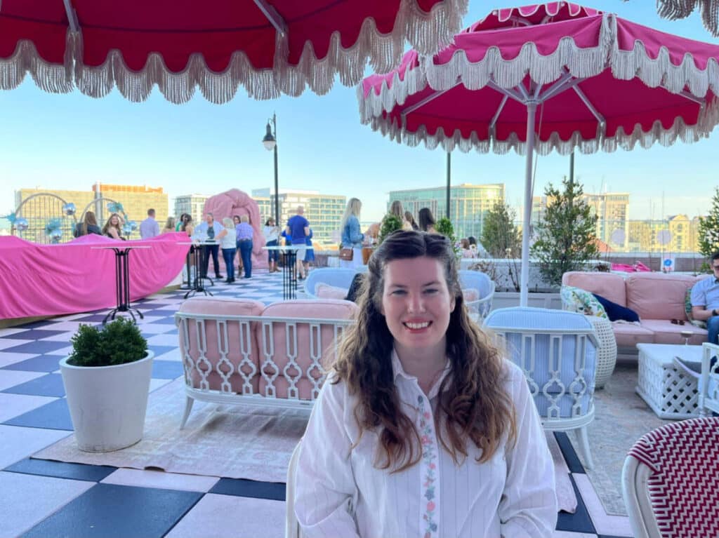 The author, Elizabeth Demolat smiling for a photo at the rooftop of White Limozeen in Nashville