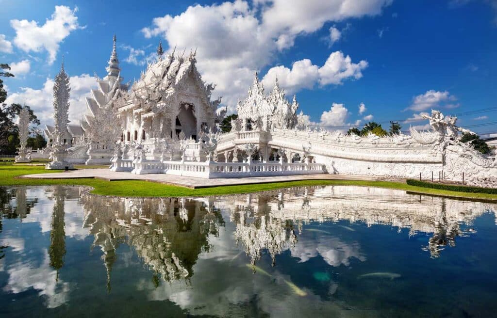 Reflection of the majestic White Temple of Chiang Rai on a pond
