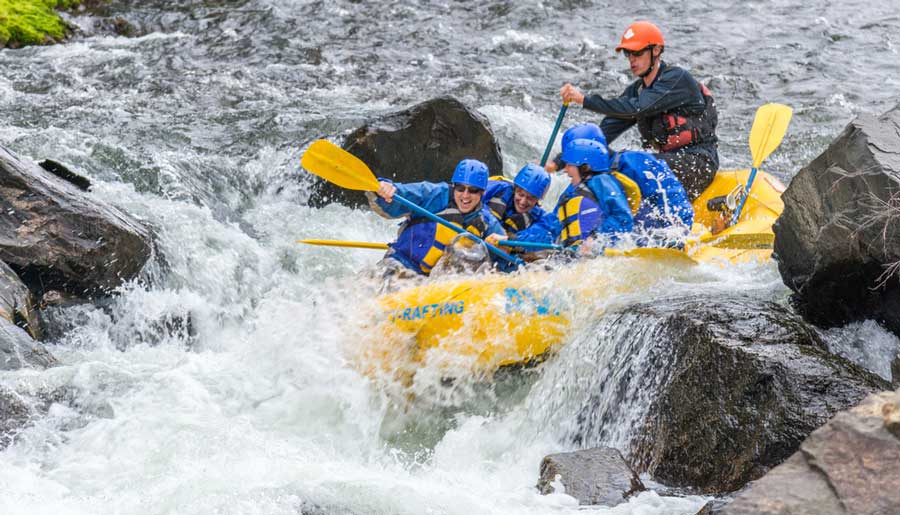 A group of people whitewater rafting in Clear Creek