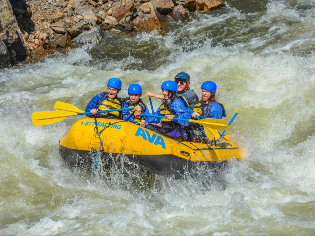 Author Abigail and her friends whitewater rafting down Clear Creek