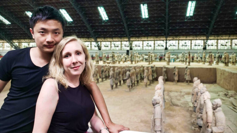 The author Sarah Heath and her husband, posing for a photo at the Terracotta Army in Xi’an, Why Travel to China