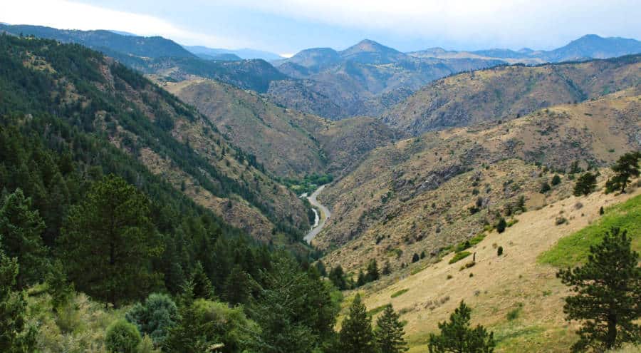 Aerial view of the road in between the mountains from Windy Saddle Park
