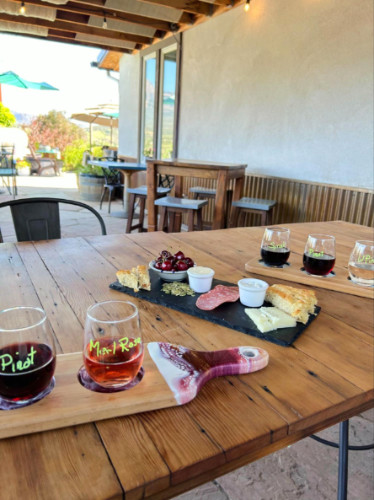 Wine tastings and charcuterie on the table at Qutori Winery
