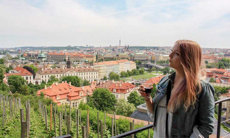 The author, Taylor Herperger holding a wine glass in Prague
