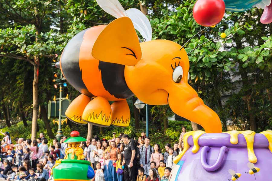 A Winnie the Pooh character during a parade in Disneyland