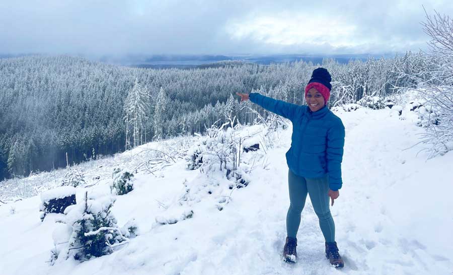 The author at the top of a snowy mountain during a hike
