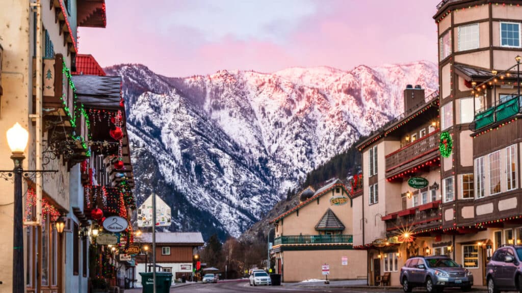 View of the snow covered mountain from downtown Leavenworth at sunset