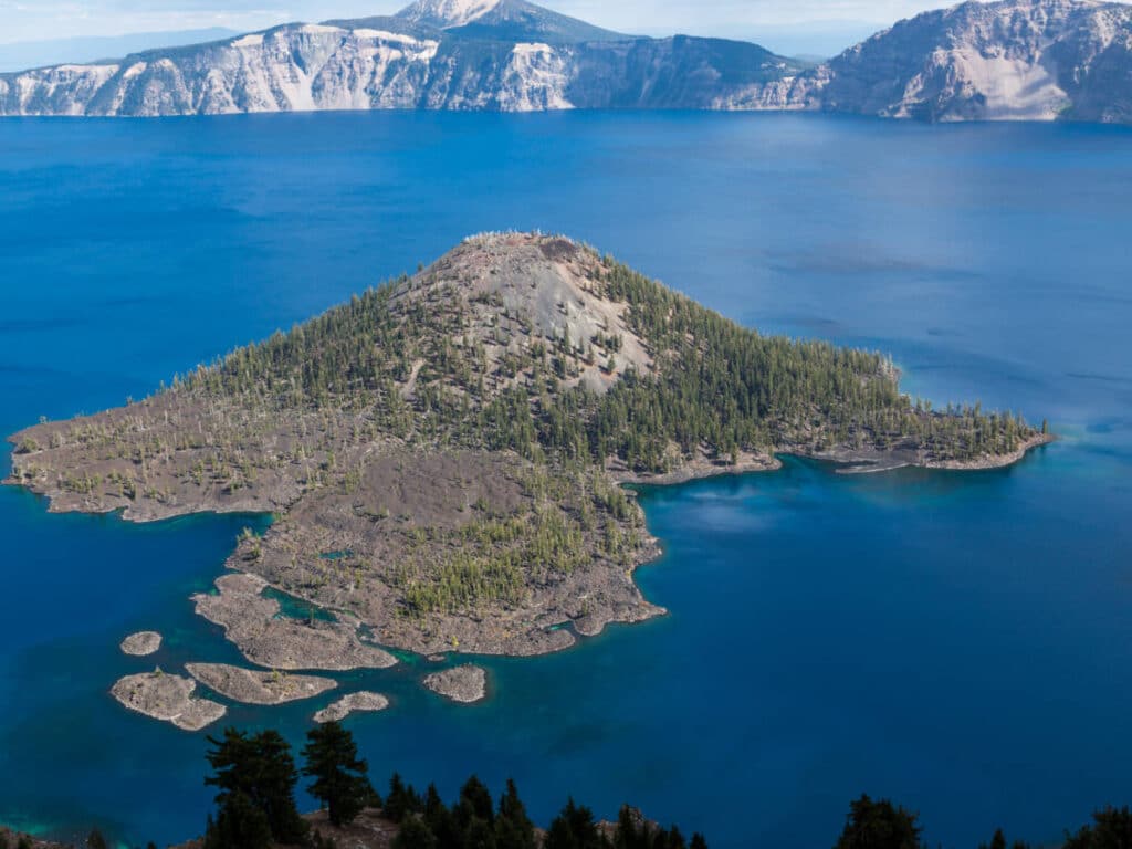 Aerial view of the Wizard Island and the blue water that surrounds it