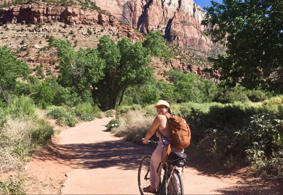 A woman biking at the Pa’rus Trail in Zion National Park