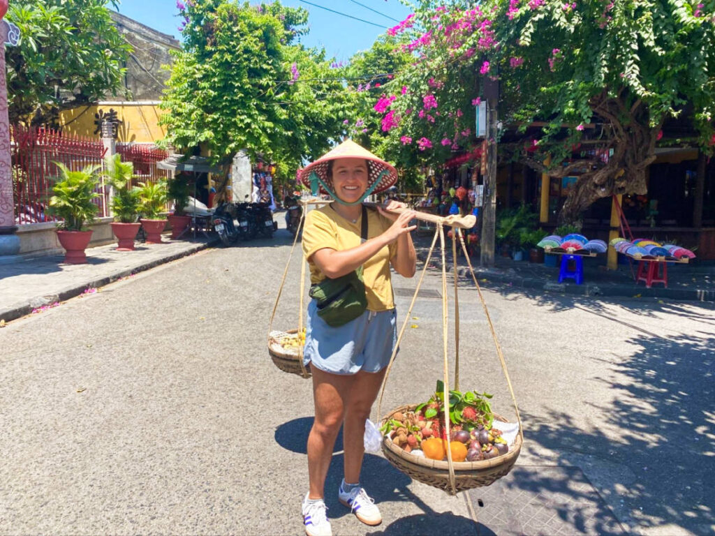 The author's partner carrying the infamous fruit basket in the middle of the street