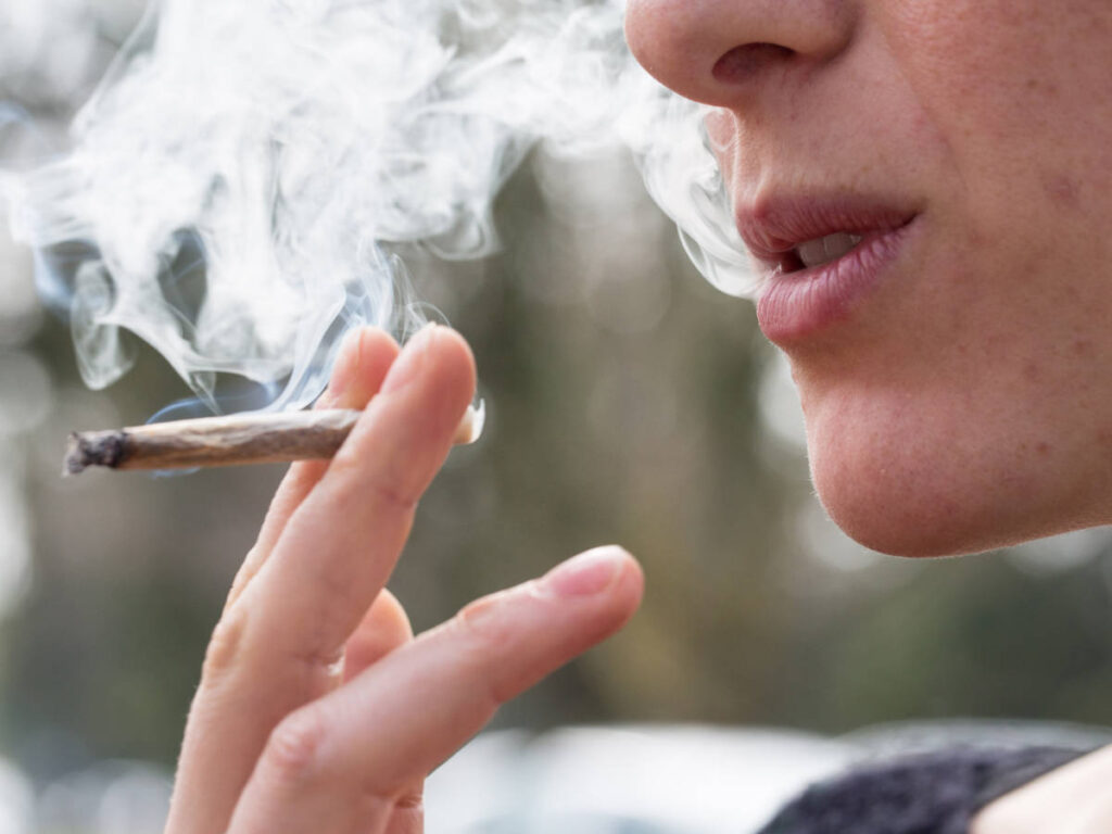 Closeup look of a woman smoking