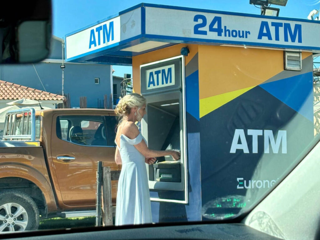 A woman at the ATM in Greece