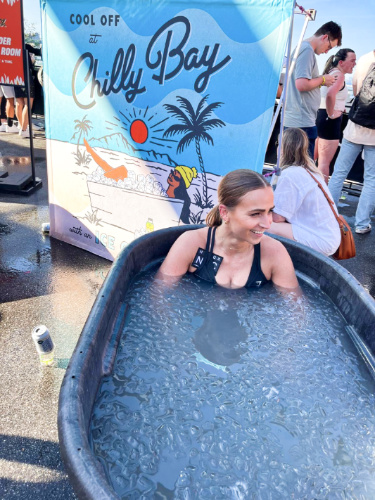 A woman on the tub with ice cubes