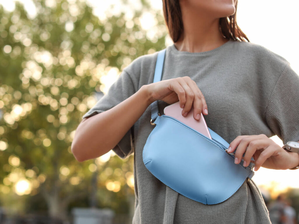 A woman with a blue fanny pack