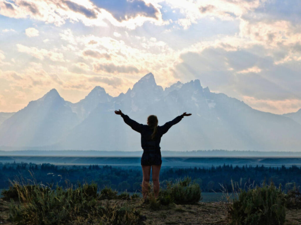 A woman admiring the breath taking view of Grand Teton National Park