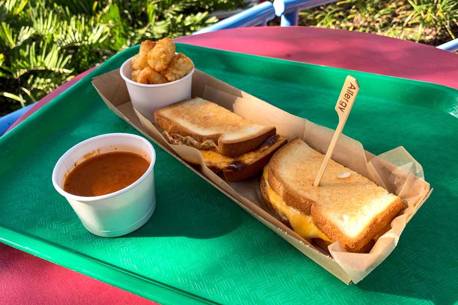 Grilled cheese and tomato soup on a tray from Woody's Lunch Box