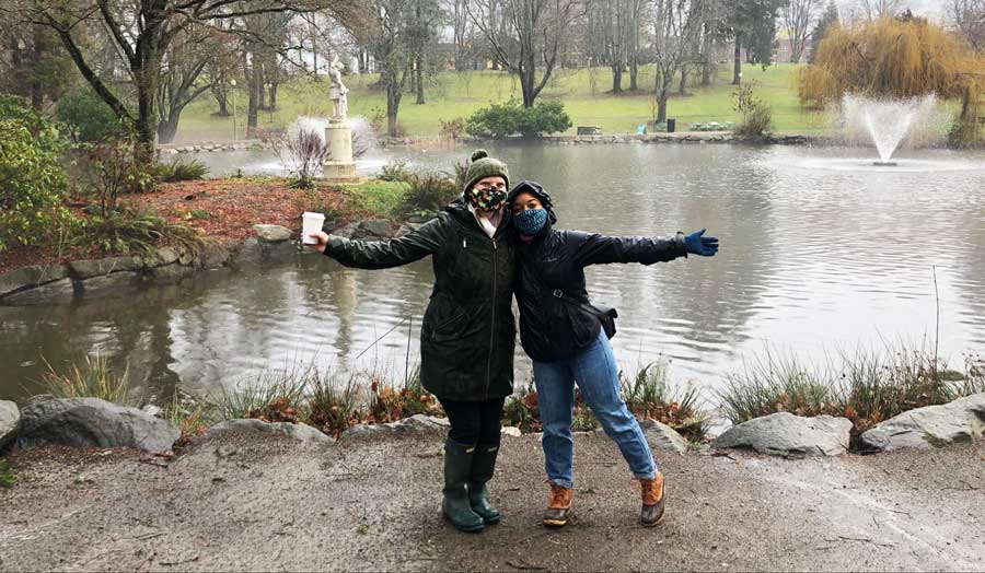 The author and her friend and the pond in Wright Park on their background