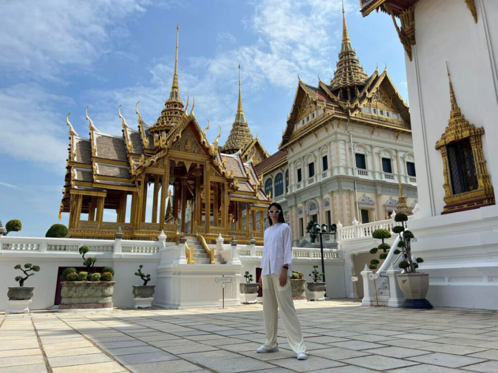 Writer Clara posing for a photo at the Grand Palace