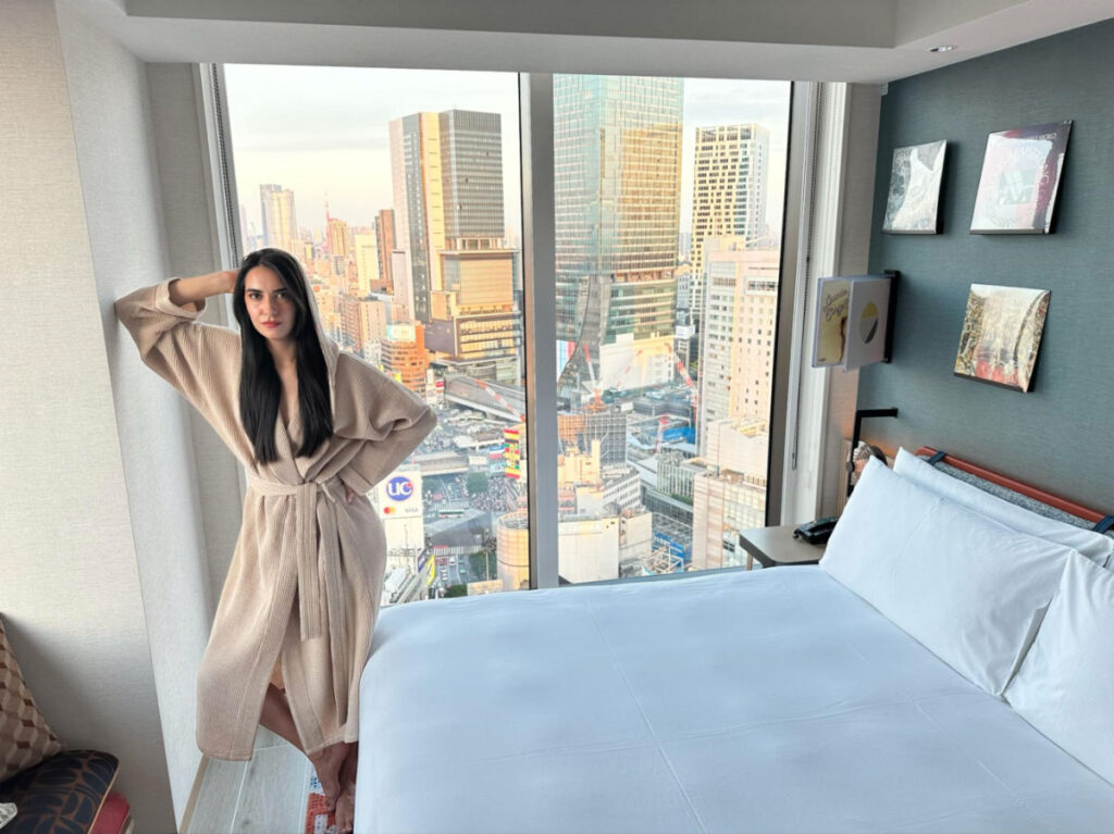 Writer Clara standing in a room at the Hotel Indigo Tokyo Shibuya