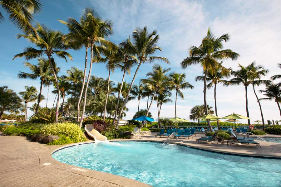View from the pool area with a small slide in Wyndham Grand Rio Mar Golf & Beach Resort
